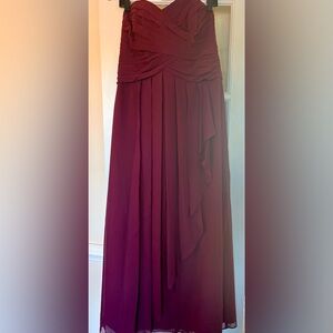 Simple and elegant at strapless burgundy dress.